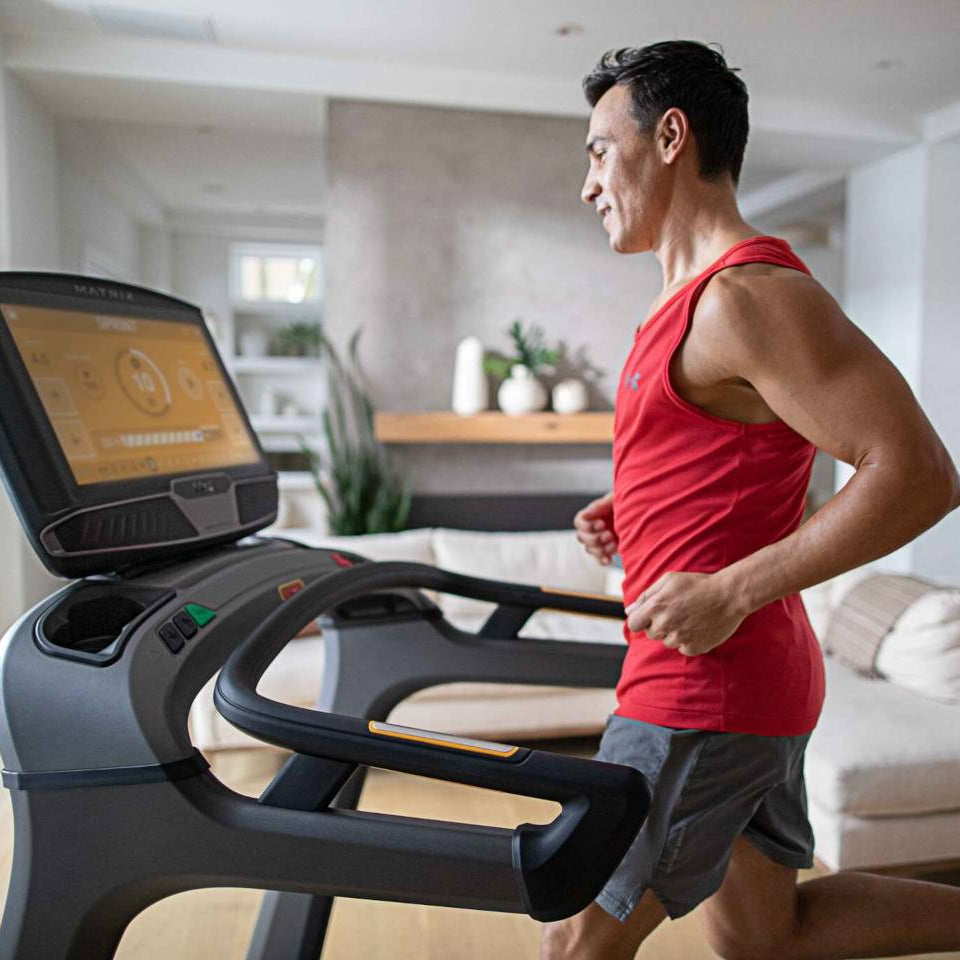 Matrix elliptical front view with compact frame, smooth stride system, and ergonomic handlebars for home cardio workouts