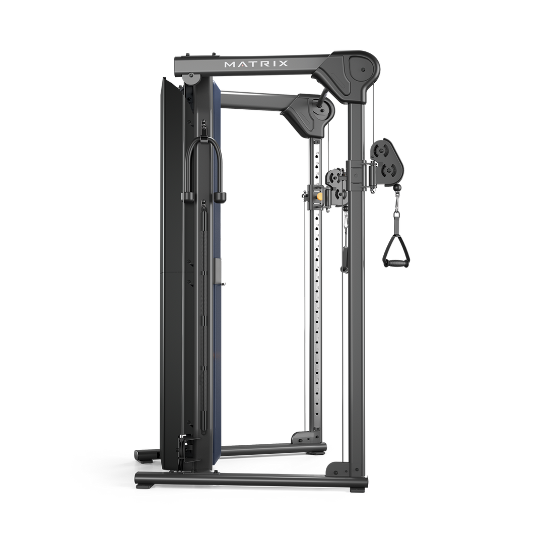 Side profile of Matrix functional trainer showing dual adjustable pulleys and weight stacks for full body strength training