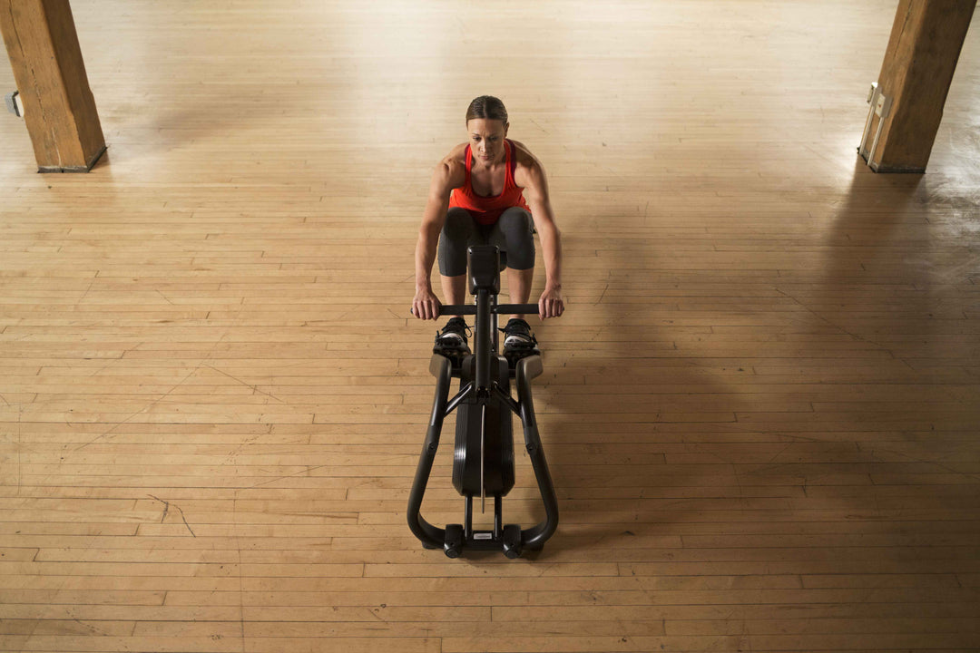 Overhead view of the Matrix rowing machine in a home gym.
