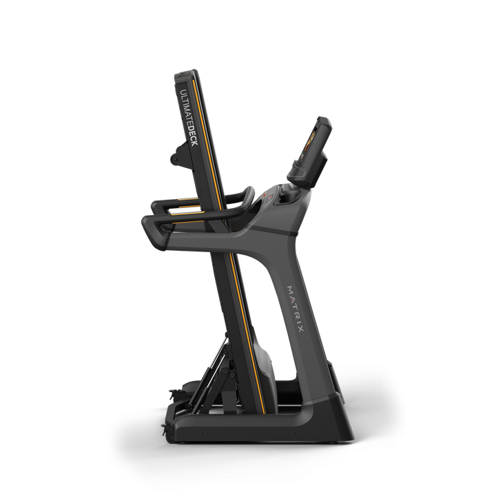 Side profile of Matrix TF30 folding treadmill in upright folded position with XIR touchscreen console and compact storage design