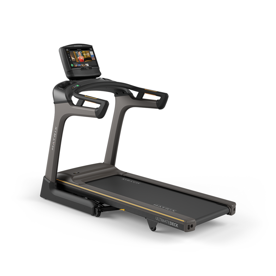 Matrix TF30 folding treadmill hero image featuring XIR touchscreen console, Ultimate Deck cushioning, and modern home fitness design