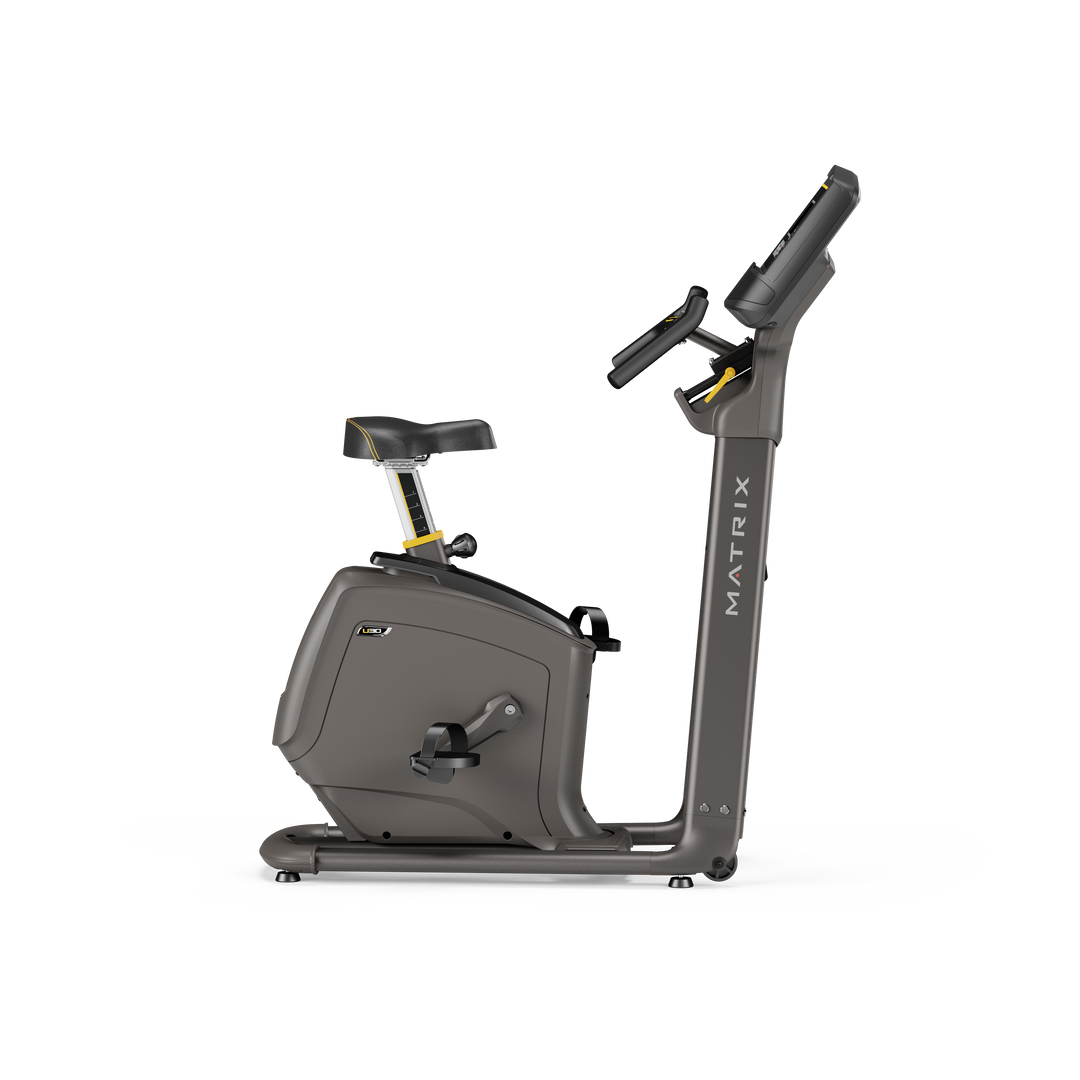 Side profile of Matrix U30 upright bike with XR LED console showing compact frame and ergonomic design for home cardio workouts