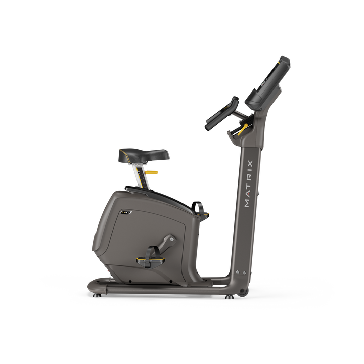 Side profile of Matrix U50 upright bike with XR LED console showing ergonomic frame and smooth pedaling for home cardio workouts