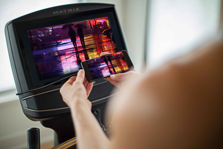 Back angle view of Matrix XIR console showing HDMI port and connectivity options for integrated cardio equipment setup