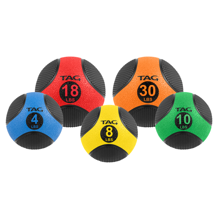 Color-coded medicine ball set in multiple sizes for strength training