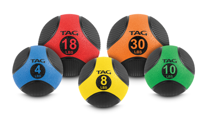 Medicine ball collection in multiple color-coded sizes from 4 to 30