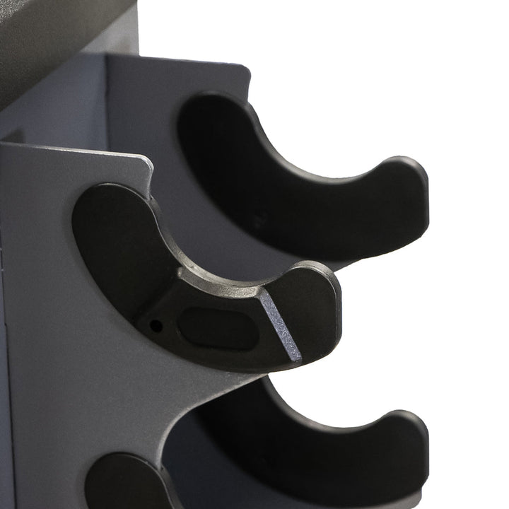 Close-up of injection-molded nylon cradle on vertical dumbbell rack