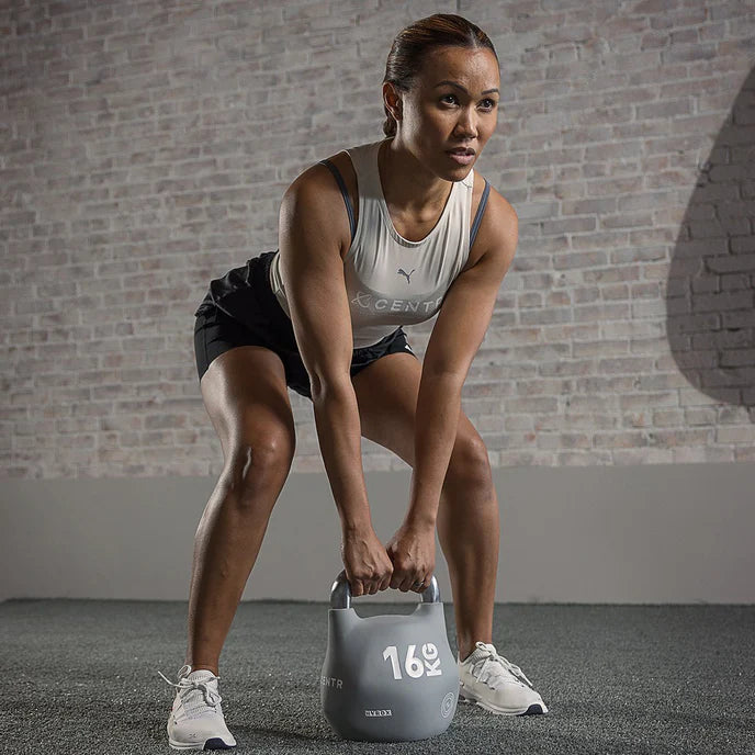 Athlete training with a Centr x HYROX Competition Octo Kettlebell during a strength workout.