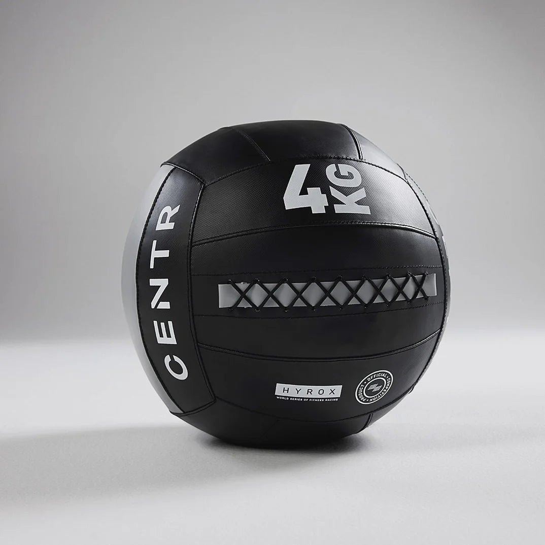 Side profile of the Centr x HYROX Official Wall Ball with textured PVC shell.