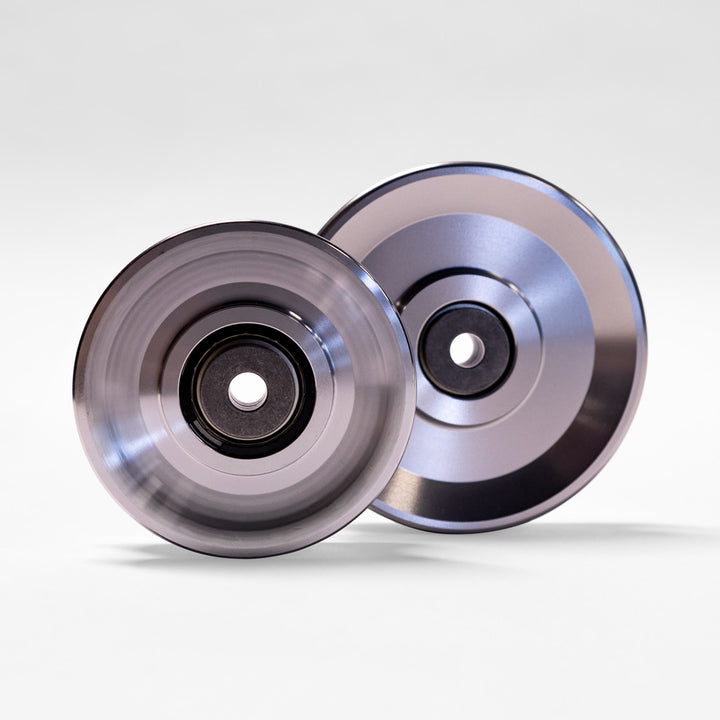 Two Body-Solid AP4 aluminum pulleys displayed together for cable machine applications.