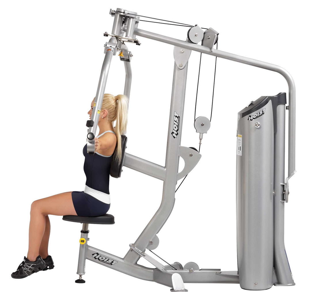 person performing chest fly exercise on pec fly machine targeting chest muscles