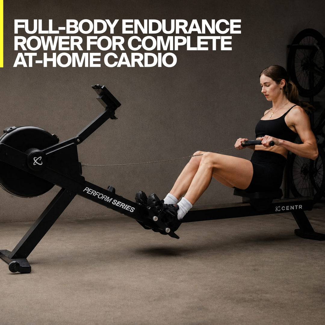 Person using the Centr Perform Series rowing machine during a home cardio workout.