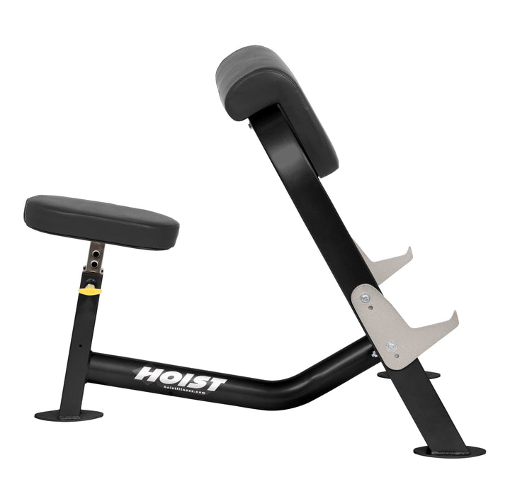 Preacher curl bench side profile showing ergonomic pad and seat for controlled arm curl strength training exercises