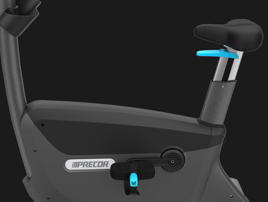 Precor UBK 800 Series upright bike in Strom Grey color with light blue accents