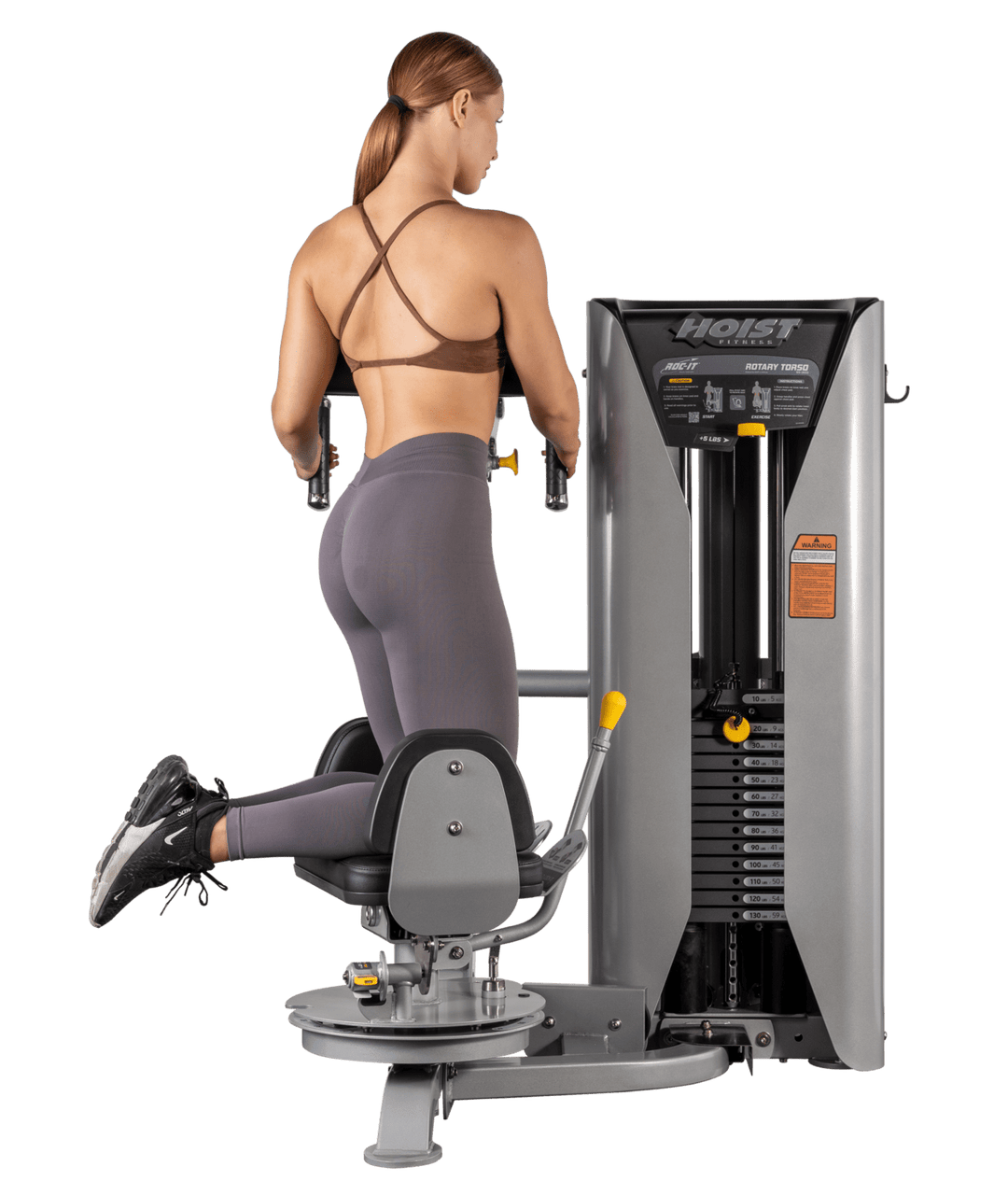 rear exercise movement demonstration on Rotary Torso machine showing full rotational torso workout motion
