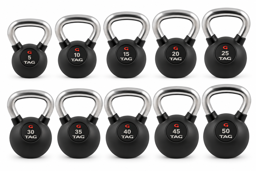 Set of black rubber encased kettlebells with smooth chrome handles in multiple weights