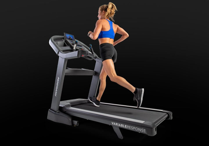 Runner exercising on the Horizon Elite 7.0 AT treadmill.