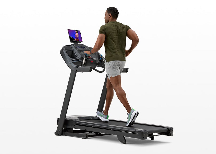 Person running on the Horizon 7.0 AT folding treadmill.