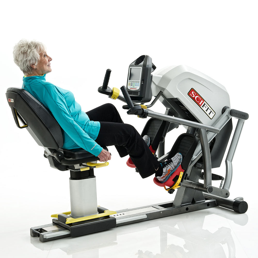 Recumbent stepper cardio machine side view with ergonomic seating and pedal motion for home fitness use