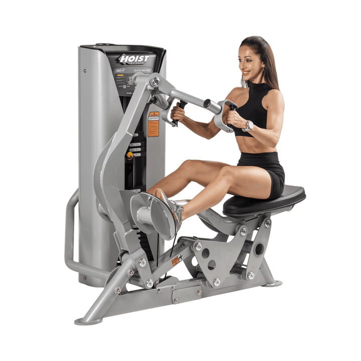 woman performing seated row pulling handles toward torso demonstrating proper contraction and rowing form