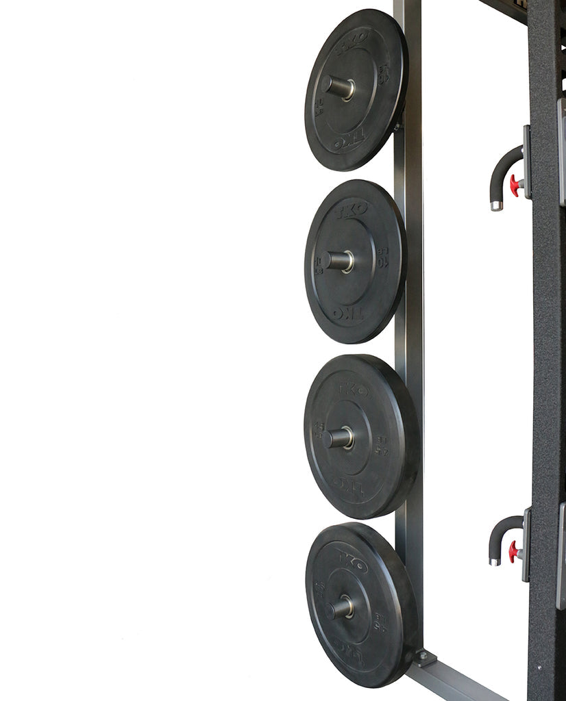 Side view showing integrated weight plate storage on the Defiant Strength half rack.