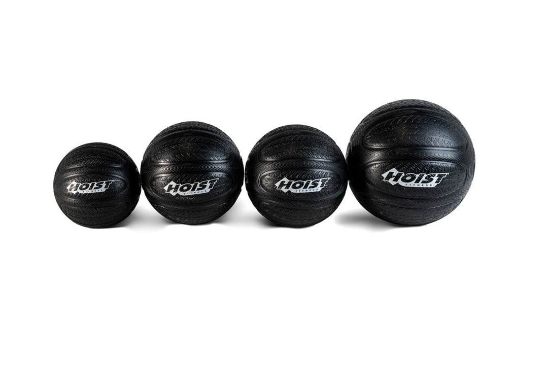 HOIST slam balls designed for strength training, conditioning workouts, and functional fitness exercises