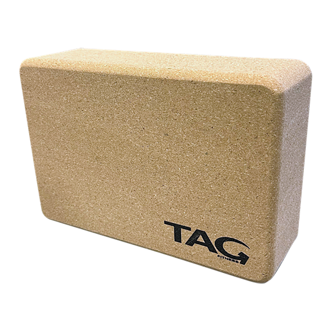 TAG cork yoga block measuring 9 x 6 x 3 inches with rounded edges and natural cork surface