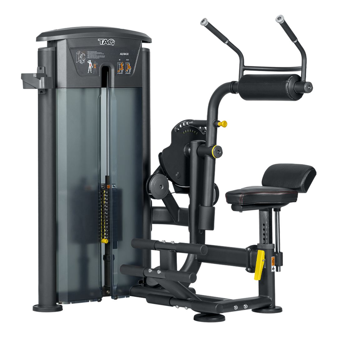 TAG Fitness ELITE Ab/Back machine in black with weight stack, padded seat, handles, and enclosed shrouds