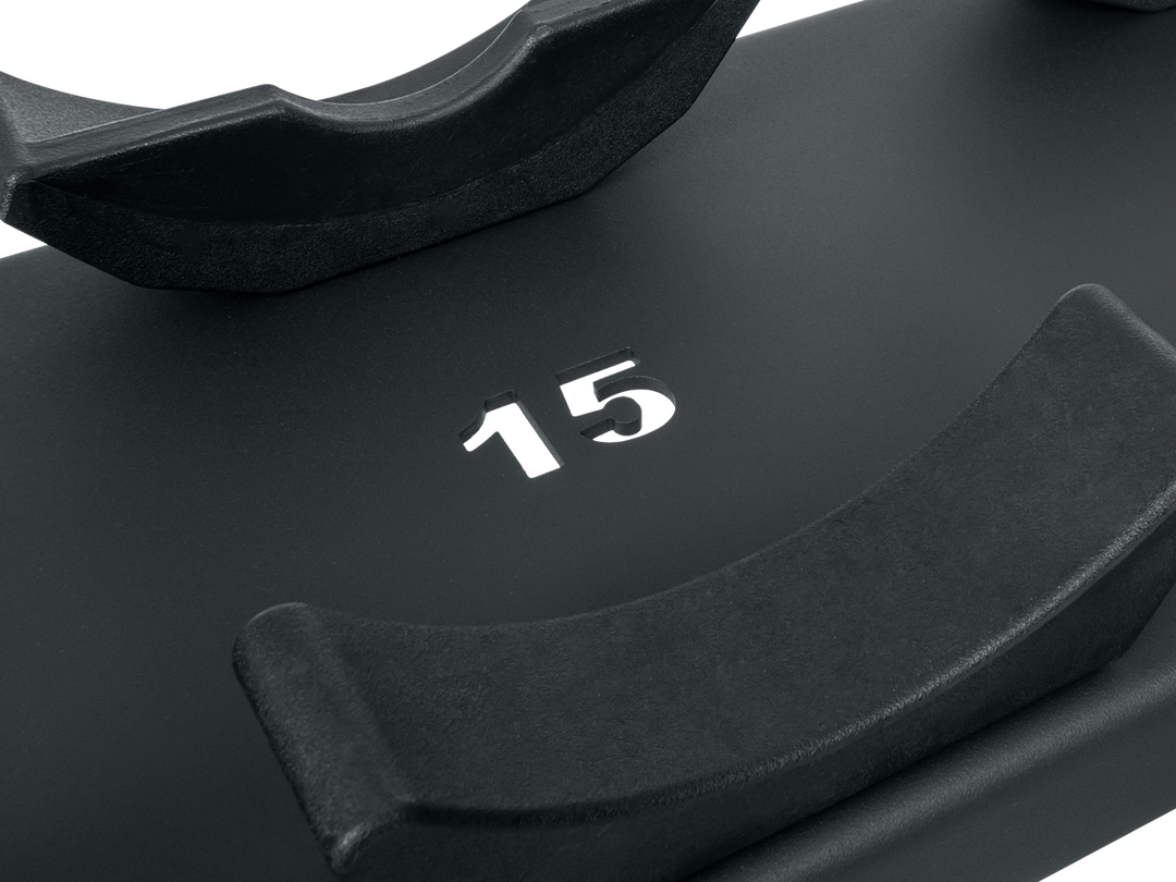 Close-up of TAG dumbbell saddle rack with laser-cut weight numbering on the saddle