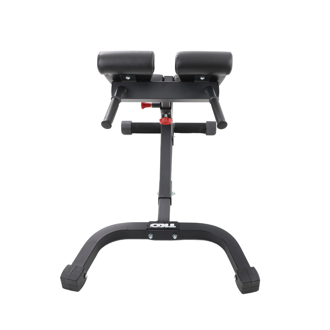 Front view of TKO hyperextension bench with split pads and leg support rollers.