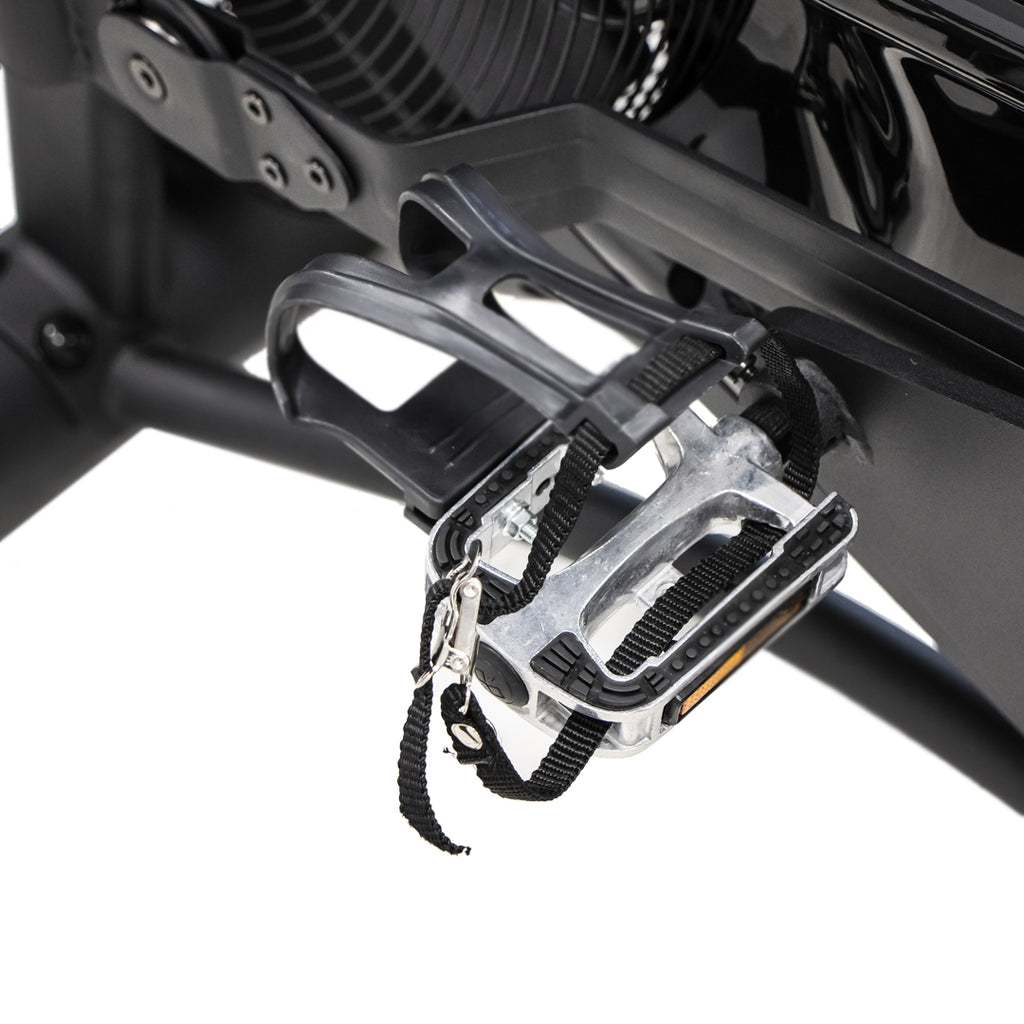 close-up of TKO AirRaid bike pedal and crank assembly with adjustable foot straps for secure cycling workouts