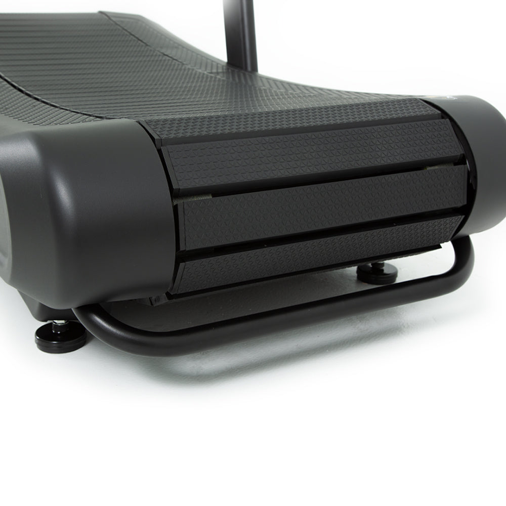 side close-up of curved slat belt running surface on TKO AirRaid manual treadmill for smooth natural stride movement