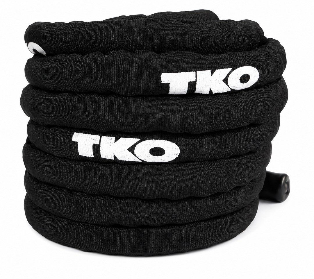Black TKO deluxe battle rope coiled for storage and training use