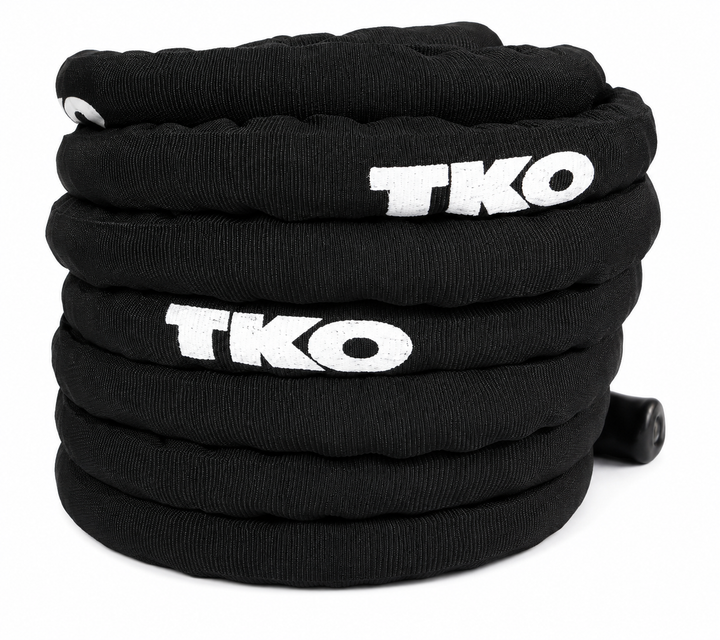 Black TKO deluxe battle rope coiled for storage and training use