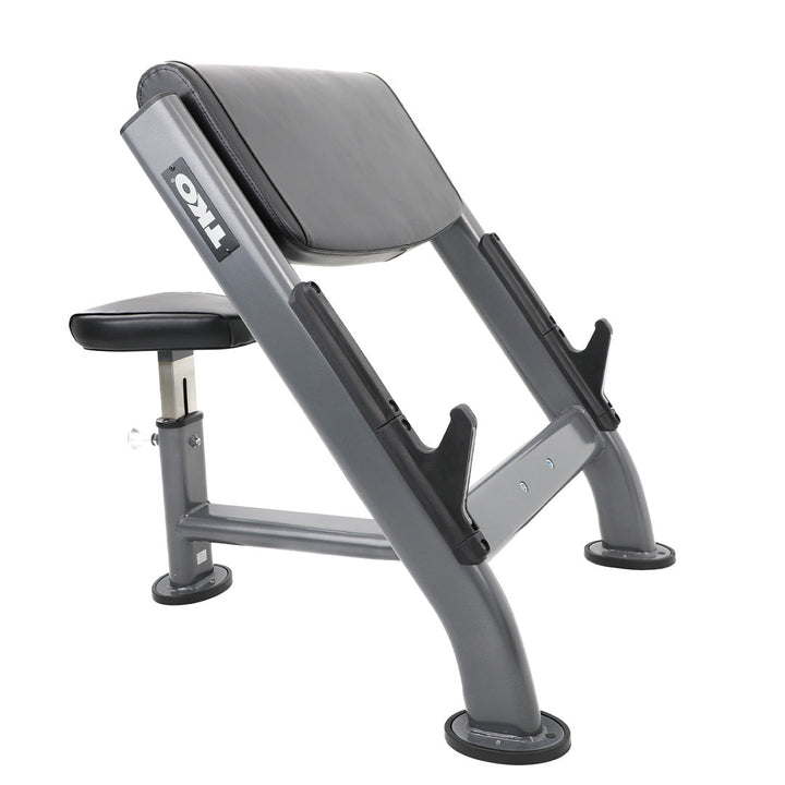 TKO preacher curl bench with adjustable seat and angled arm pad