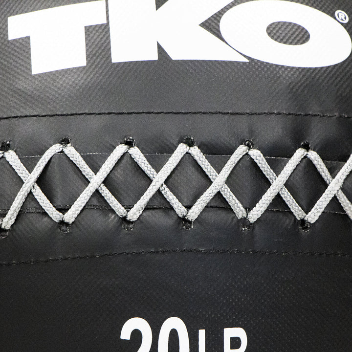 Close-up of reinforced gray lacing and stitching on TKO wall ball