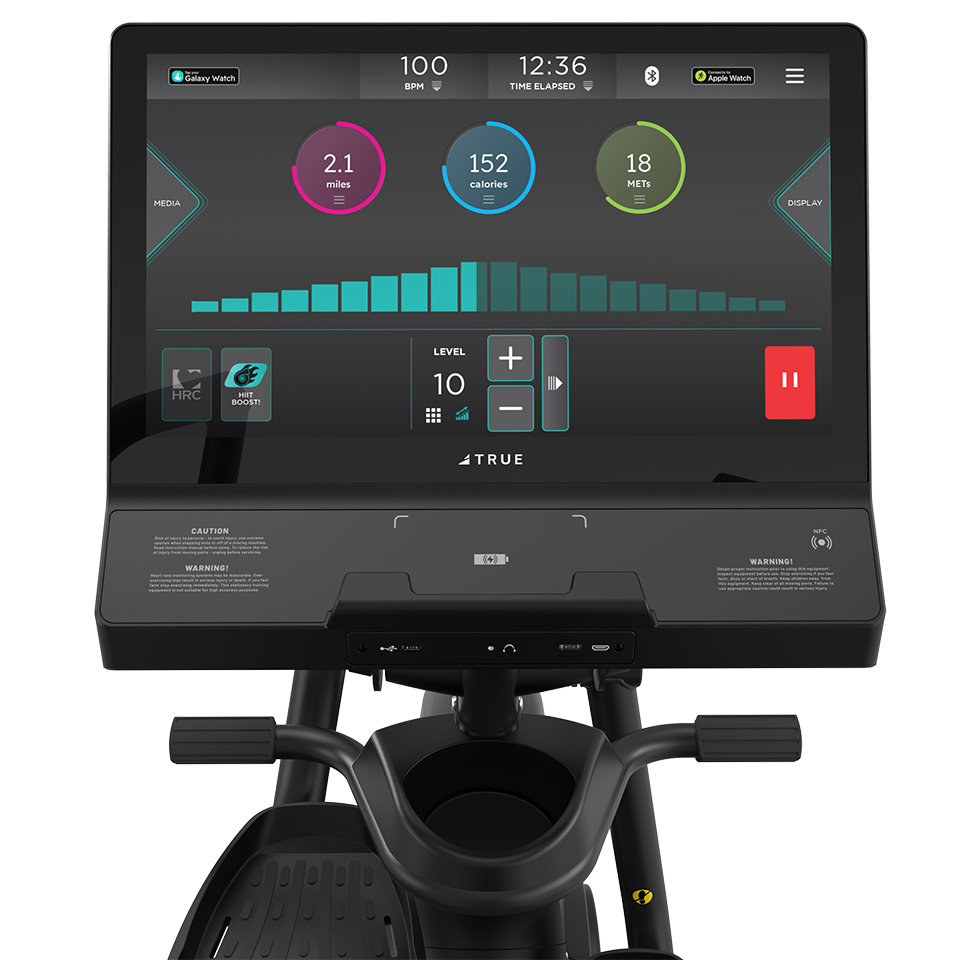 TRUE Apex XRide recumbent elliptical console showing a color workout interface and controls