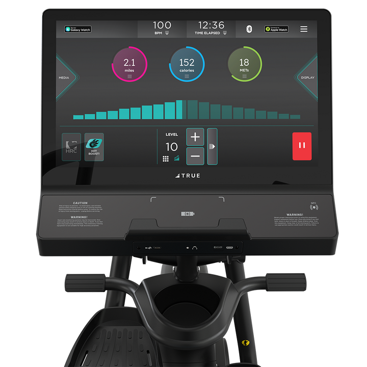 TRUE Apex XRide recumbent elliptical console showing a color workout interface and controls
