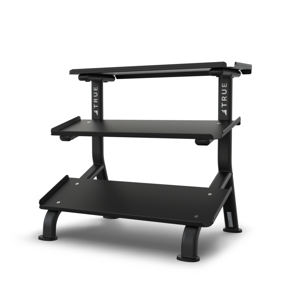 TRUE FS-24 3-tier flat tray dumbbell rack shown empty from the front with three storage trays