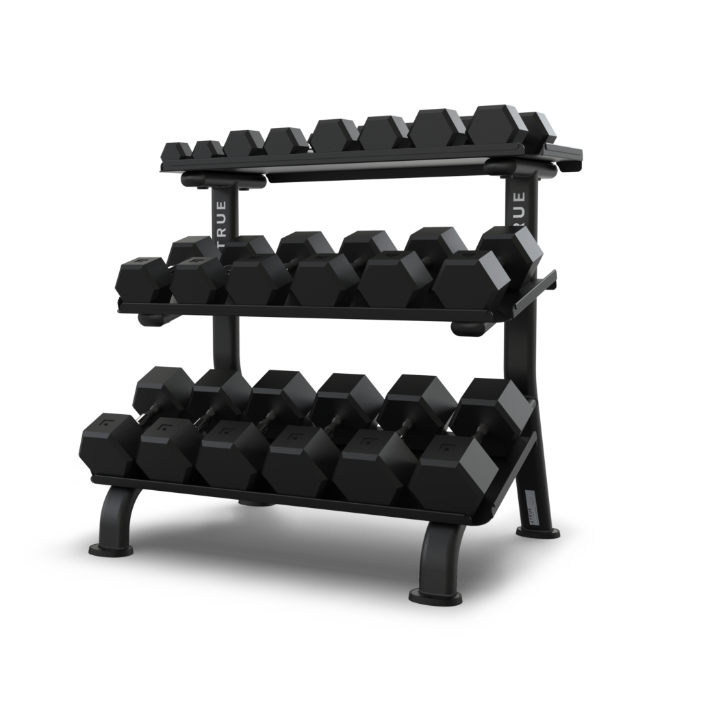TRUE FS-24 3-tier flat tray dumbbell rack shown loaded with multiple hex head dumbbells