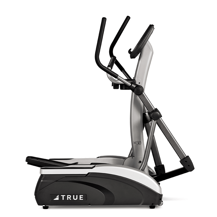 TRUE M30 elliptical with compact frame, side steps, pedals, multi-grip handles, and console