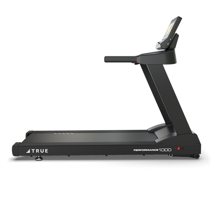 Side profile of TRUE Performance 1000 treadmill showing the running deck, upright frame, and console.