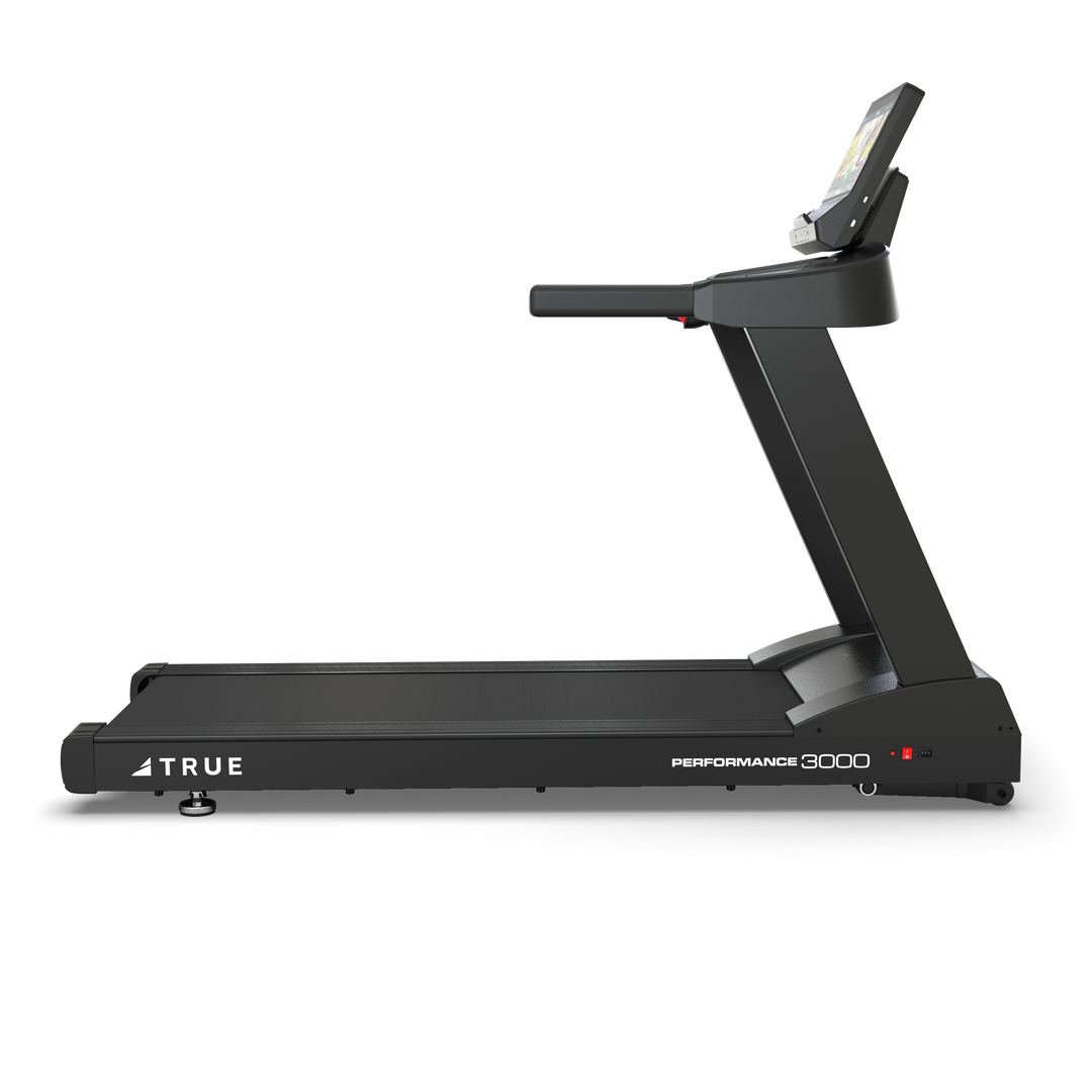 Side profile of TRUE Performance 3000 treadmill showing the running deck, upright frame, and console.