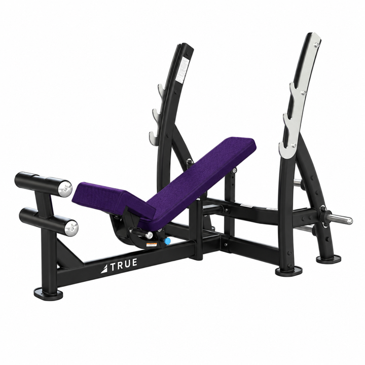 TRUE XFW-8200 3-way bench press with deep violet upholstery, bar catches, footrest, and plate holders  