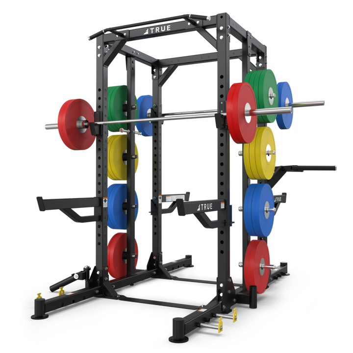 TRUE XFW-8300 dual-sided weight rack shown with barbell, weight plates, plate storage posts, and optional chin bar