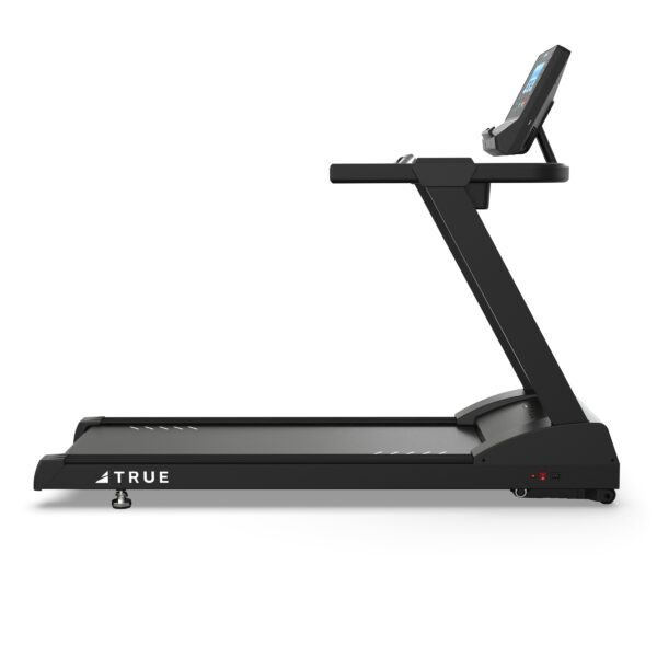 Side view of TRUE Z500 treadmill showing the running deck, upright frame, handrails, and console