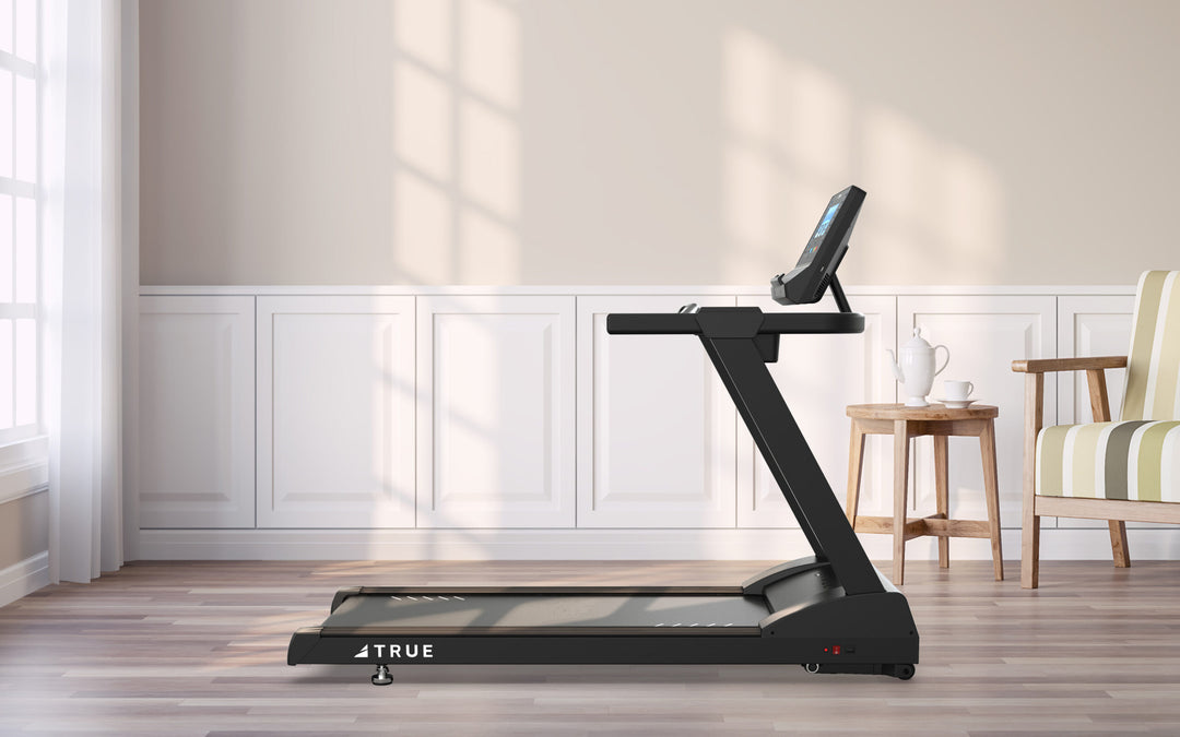 TRUE Z500 treadmill shown in a home fitness setting with running deck, console, and upright frame
