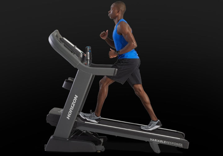Runner training on the Horizon Elite 7.0 AT treadmill with connected device.