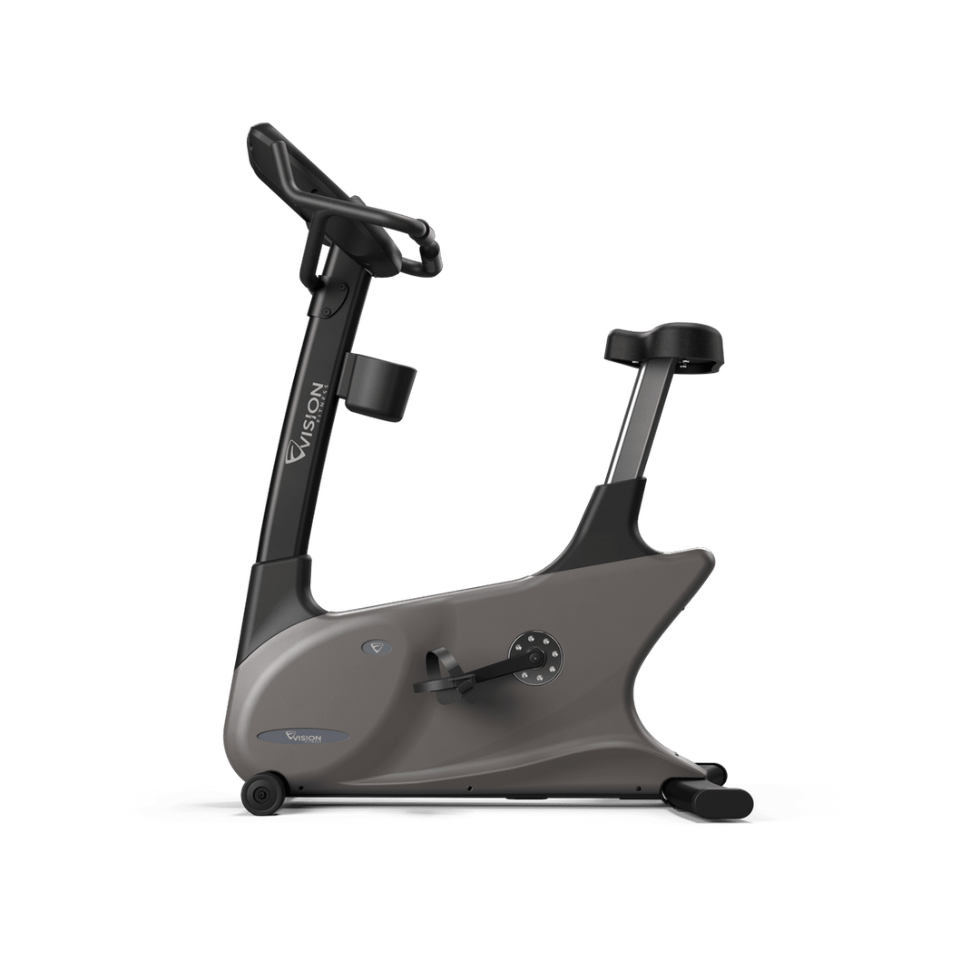 Side view of Vision Fitness U60/U600E upright bike showing contoured seat, frame, pedals, and handlebars