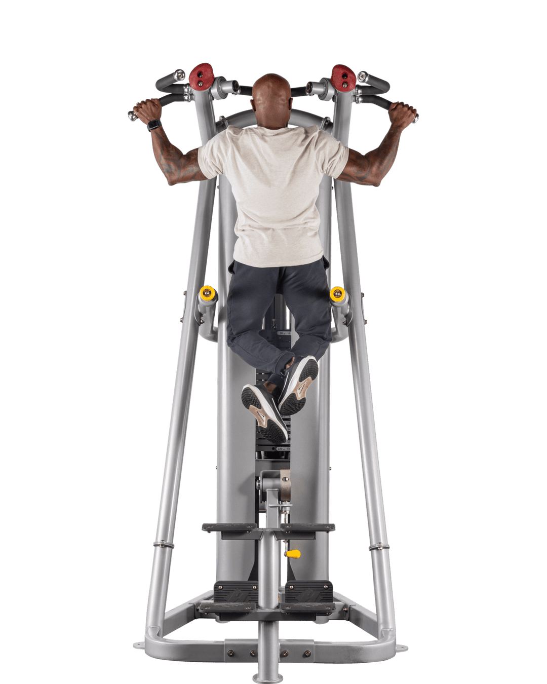 man performing pull-up on assisted machine showing full contraction at top position
